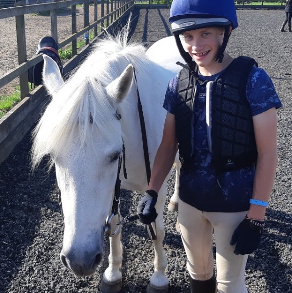 leading the pony back to the stables