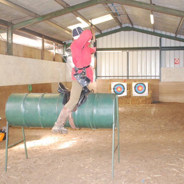 horseback archery practice on tin horse