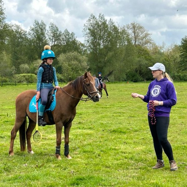 young horse rider learning about polocrosse